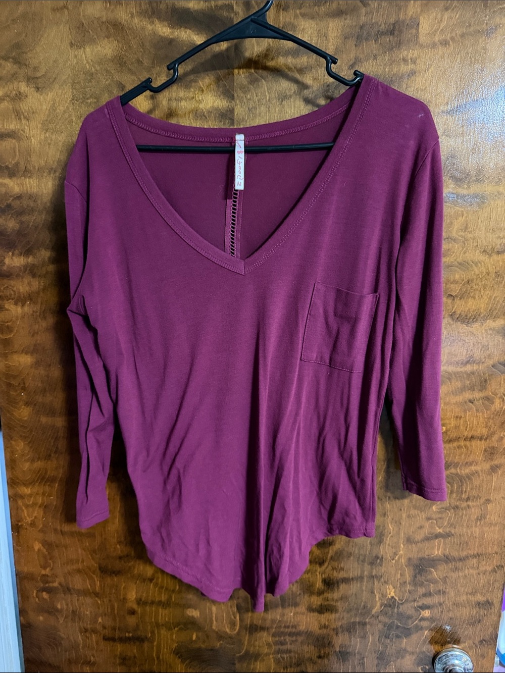 Poof! Women's V-Neck Long Sleeve Top in Wine